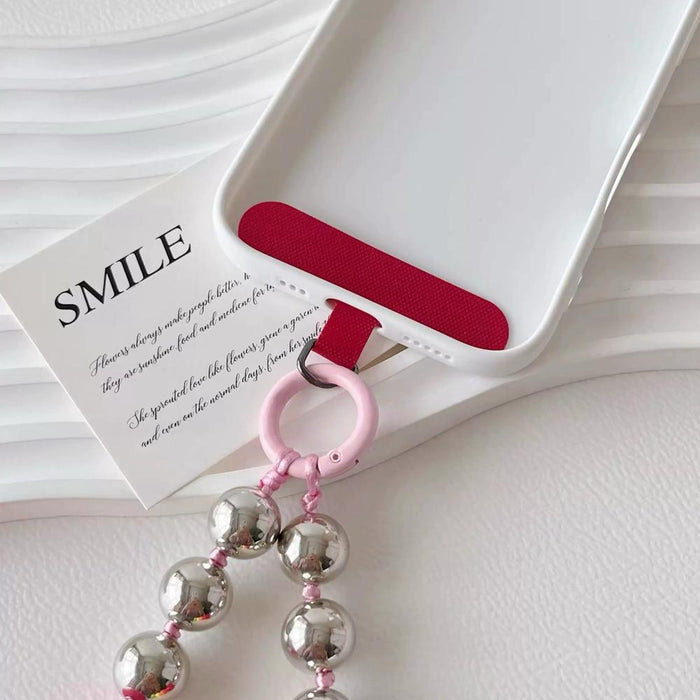 Detail view of the back side of Candy Bead Phone Charm, showcasing the connecting parts.