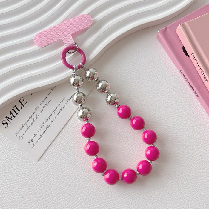 Angled view of Candy Bead Phone Charm in rose red, great for everyday styling and gifting.
