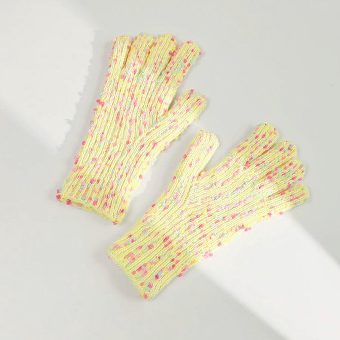 Yellow candy-dot knit gloves with raised dot texture and ribbed cuffs; warm touch for cold commutes.