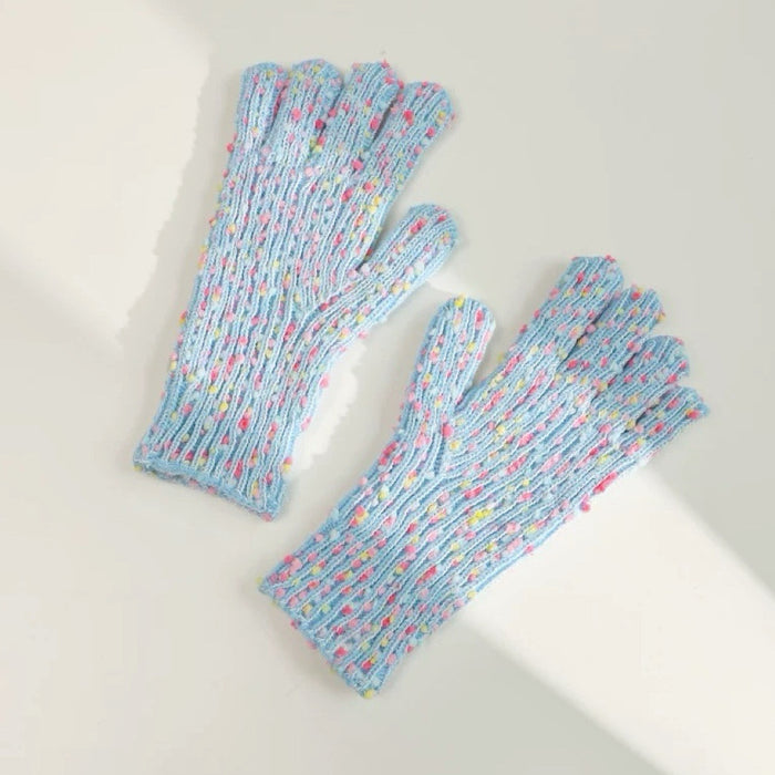 Blue candy-dot knit gloves with bobble dot texture and ribbed cuffs; soft knit for winter walks.