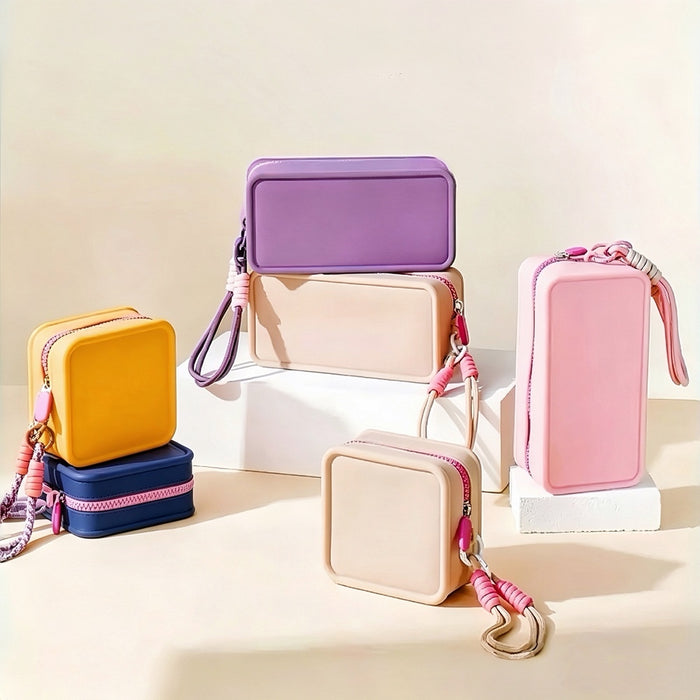 Group shot of colorful pastel silicone waterproof makeup bags stacked on display pedestals.
