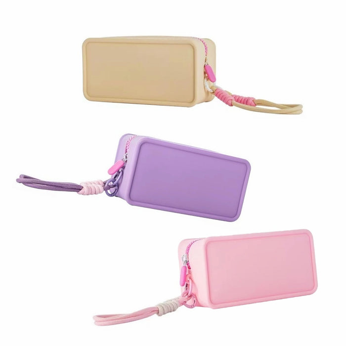 Middle size of purple, khaki and purple silicone makeup organizers arranged flat to show the slim yet flexible profile.