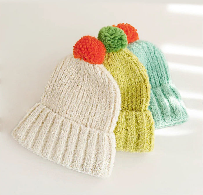 Front view of white Candy Knitted Pompom Beanie. Playful 3D pompom on soft polyester-cotton.