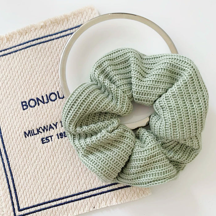 Angled view of Candy Knitted Scrunchie in mint green, great for everyday styling and gifting.