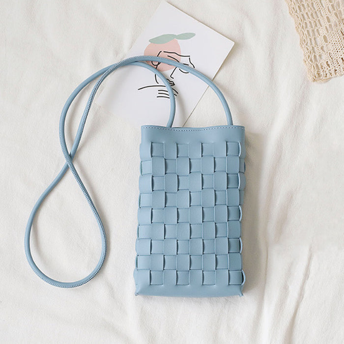 Angled view of Cassette Crossbody Bag in blue, great for everyday carry and travel.