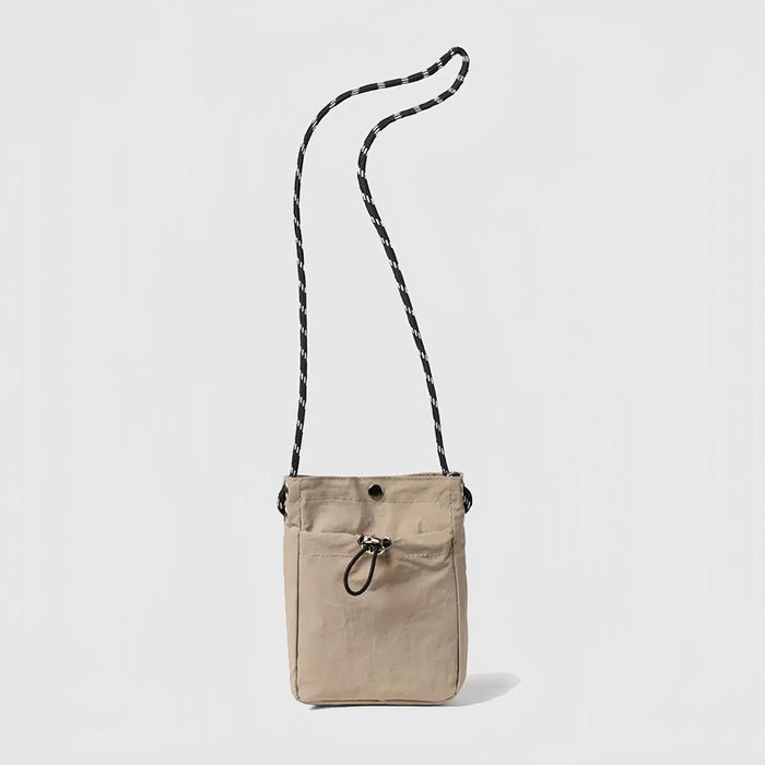 Flat lay of a mini  Casual Lite Mini Bag in khaki, great for everyday carry and travel.