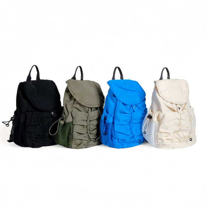 Four pleated nylon backpacks in black, olive, blue, and cream, best affordable urban rucksacks under $50.