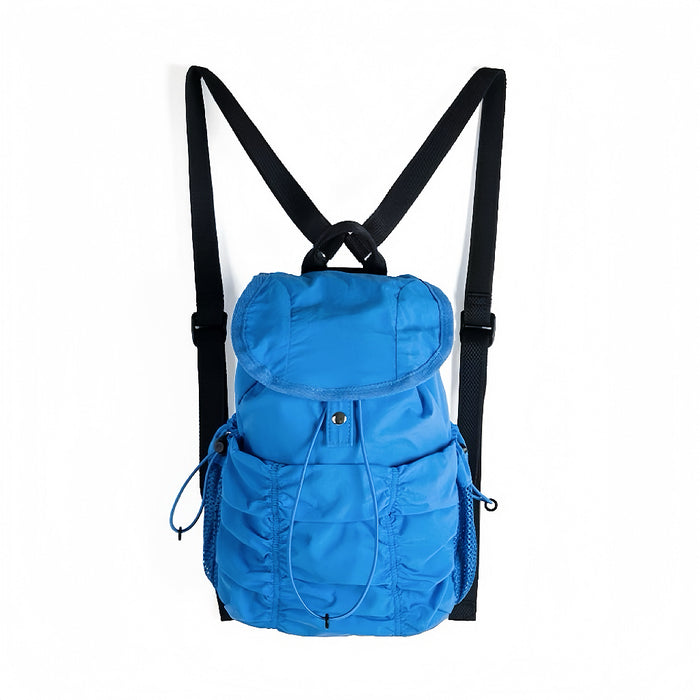 Bright blue pleated nylon backpack showing front zip pocket and drawstring side pockets for utility.
