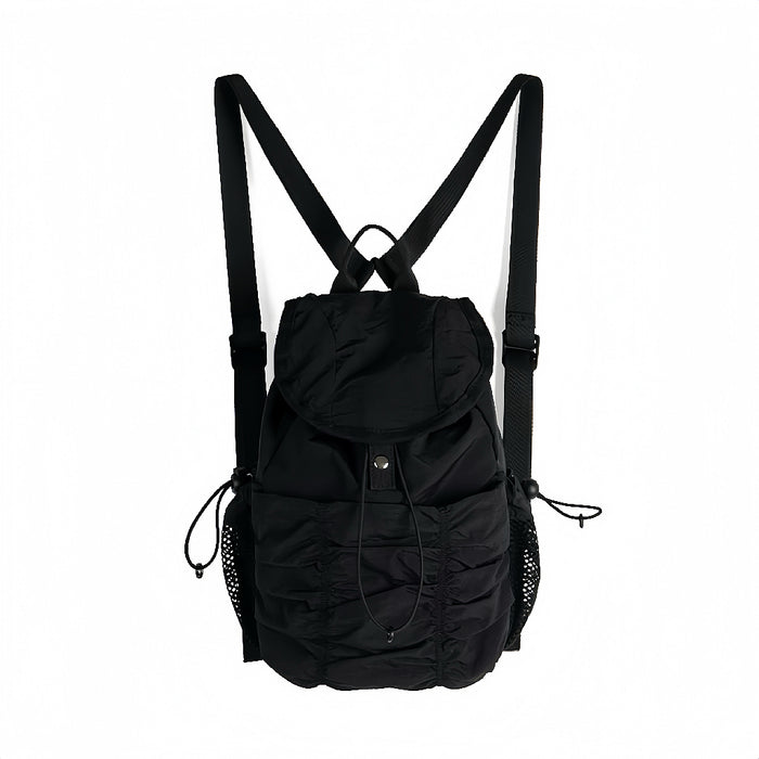 Classic black pleated nylon backpack; minimalist and sleek aesthetic for professional work or school.