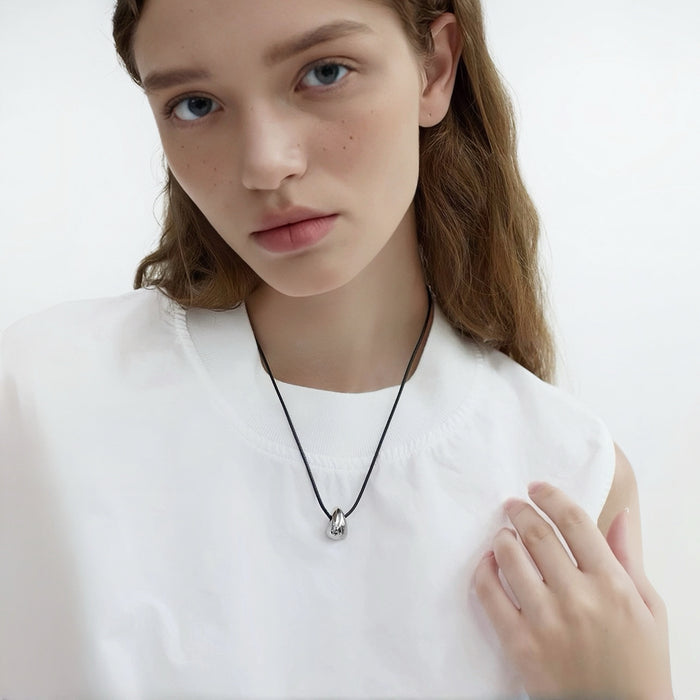 Model wearing a earrings Celestial Drop Pendant Necklace, easy for gifting and photo-ready styling.
