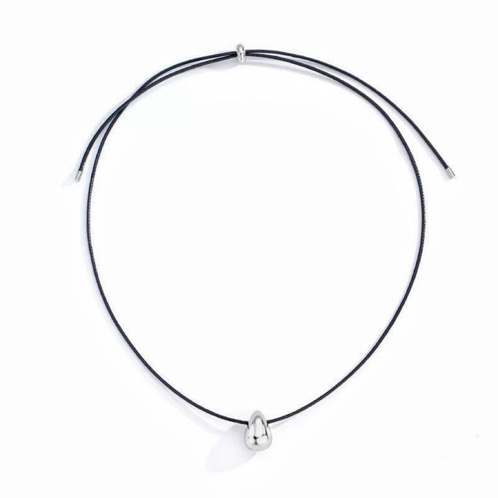 Flat lay of Celestial Drop Pendant Necklace in Silver, premium Jewelry for modern women earrings.
