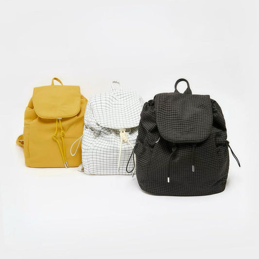 Three Check Mate Mini Backpack shown together, with drawstring and magnetic snap closures.