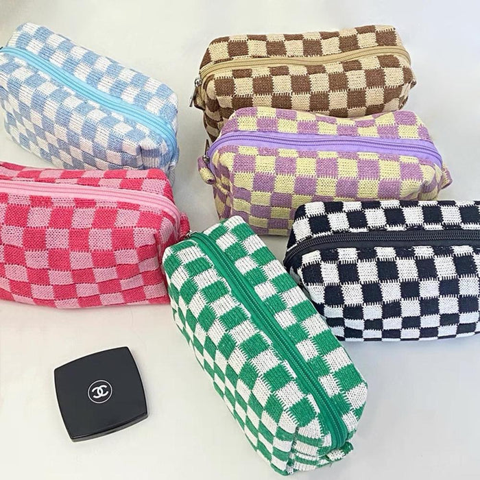 Six vibrant knit checkerboard makeup bags in pink, green, purple, blue, brown, and black; trendy dopamine aesthetic pouches.