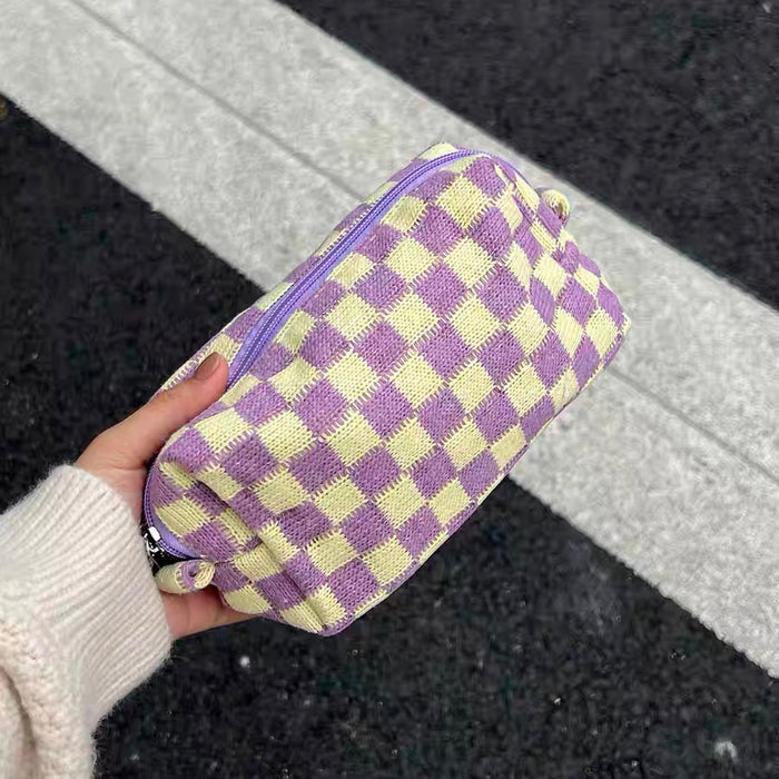 Hand-held purple checkered knit bag; showing the premium knit texture and compact size for urban daily use.