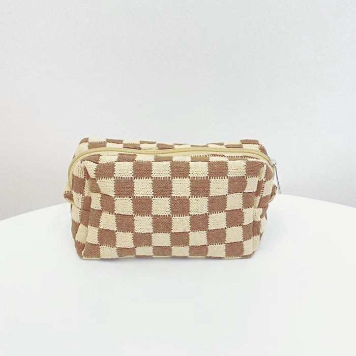 Coffee color of checkered knit makeup bag; versatile neutral accessory for cozy desk organization.