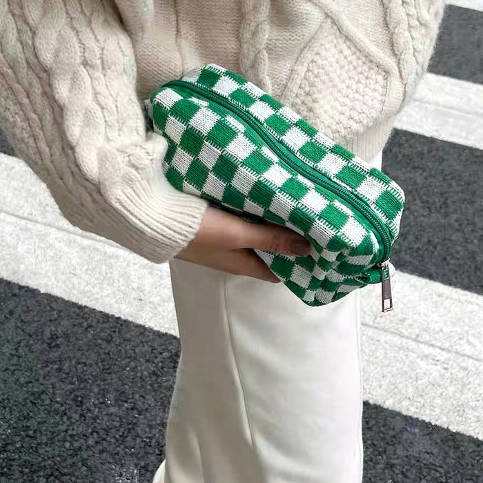 Model styling a bright green checkerboard bag as a clutch; perfect for casual outfit and vibrant street style.