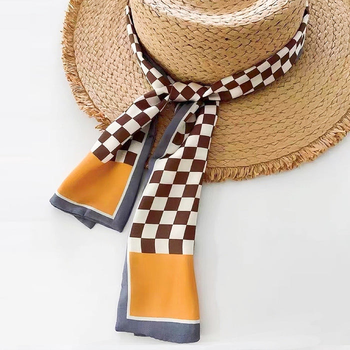 Model wearing a plaid satin scarf in orange, great for office layering and commuting.