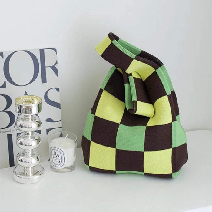 Close-up of  Green and brown checkered tote bag, ideal for errands.