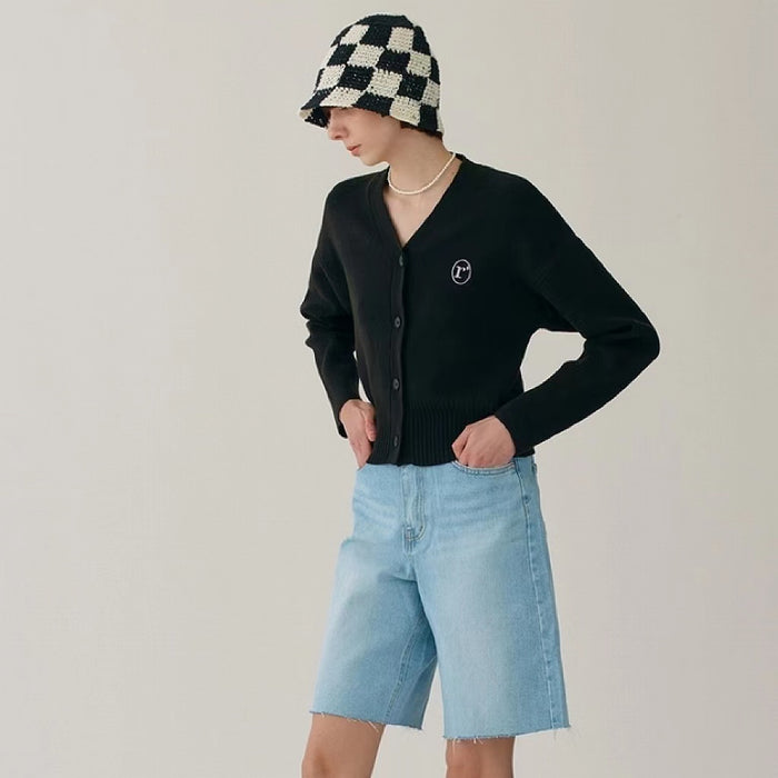 Model wearing black checkered crochet bucket hat, knitted from a breathable polyester-cotton blend.