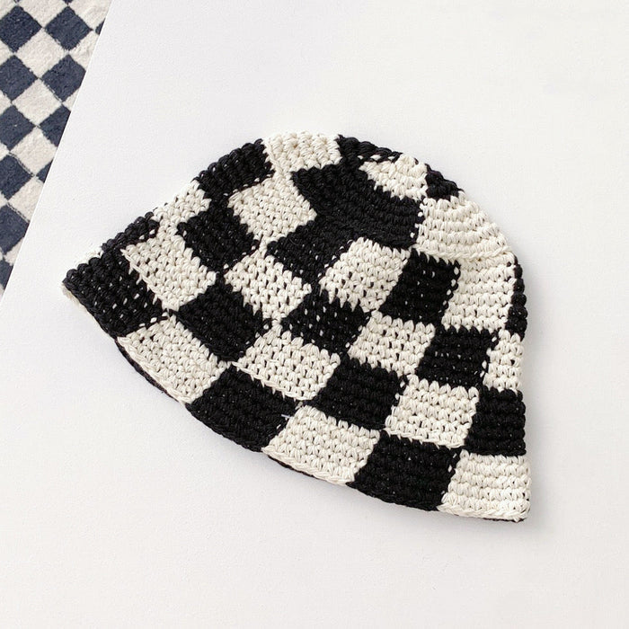 Front view of black checkered crochet bucket hat, featuring a stylish and artisanal handmade look.