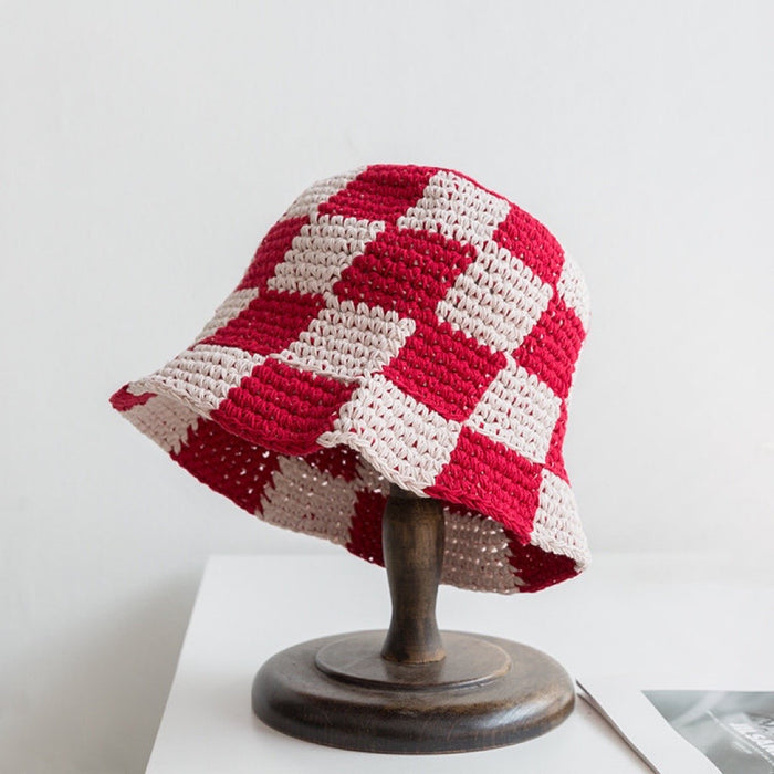 Front view of red checkered crochet bucket hat, crafted with a precise and trendy checkerboard pattern.