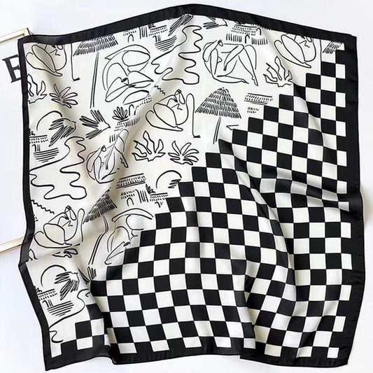 Front view of black and white satin square scarf with a checkered and abstract pattern, great for office layering.