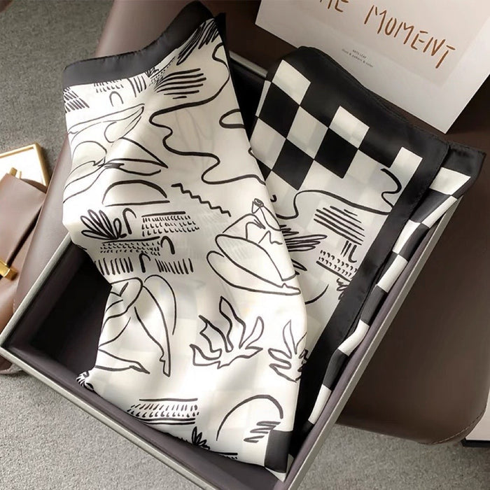 Front view of Satin square scarf with abstract black and white patterns and a checkered border, great for office.