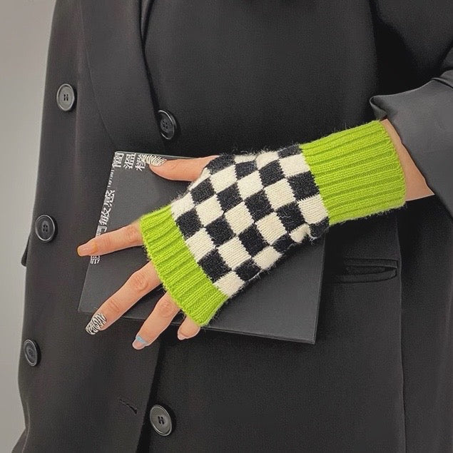 Model in lime checkered gloves; fingerless style allows easy phone use during winter city commutes.