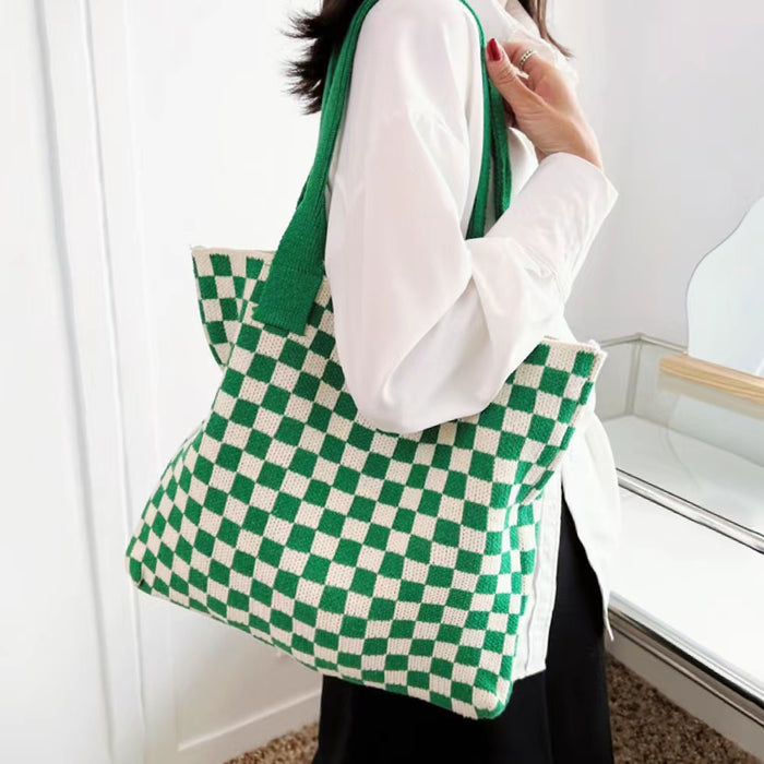 Model wearing the green and white checkered tote, showing the comfortable shoulder strap fit.