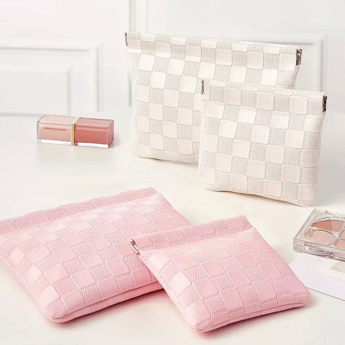 Pink and white checkered self-closing bags in multiple sizes; woven checker pouches for travel and cosmetics.
