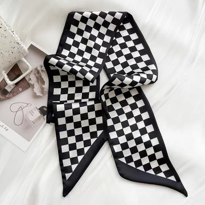 Flat lay of Checkered Silk Like Skinny Scarf in black, great for office layering and commuting.