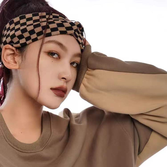 Model wearing a Checkered Twist Headband in brown, ideal for everyday outfits and office looks.