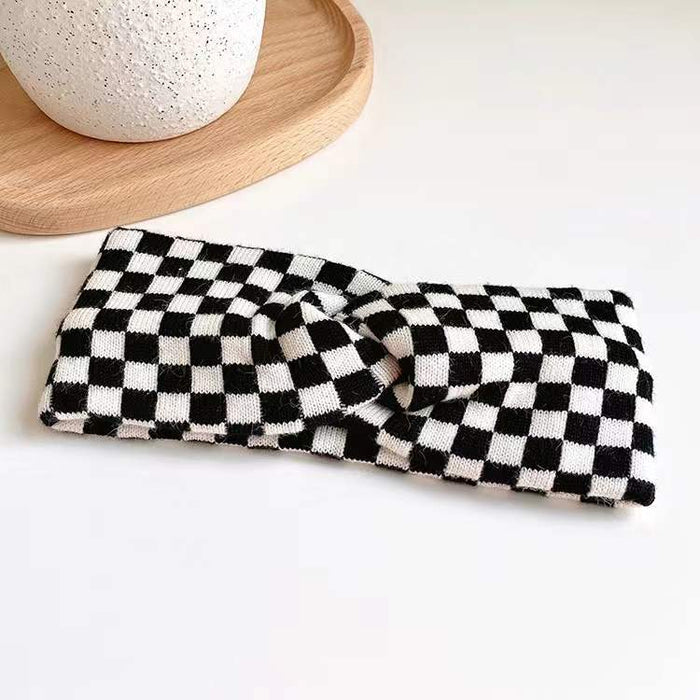 Flat lay of Checkered Twist Headband in black, great for everyday styling and gifting.
