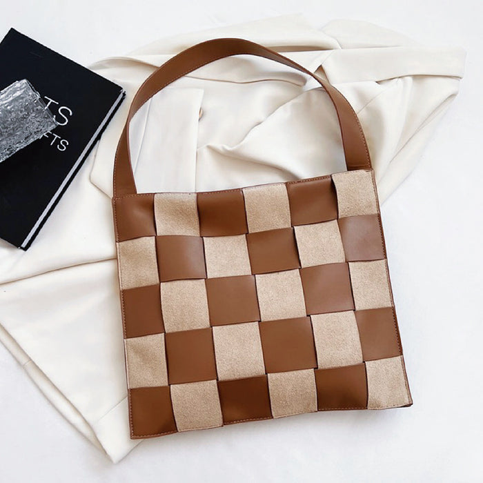 Brown checkered woven leather bag with magnetic snap, ideal for secure and chic daily carry.