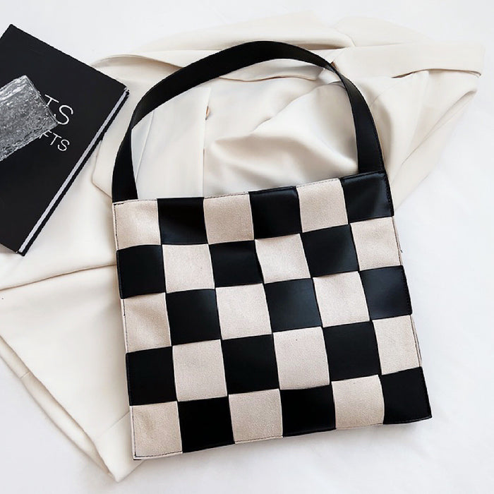 Black and white checkered woven PU leather bag shown flat, structured design perfect for organizing tablets and files.