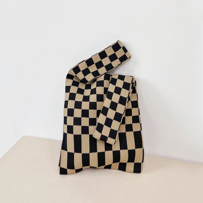 Front view of Black and coffee checkered woven polyester tote bag with two handles.
