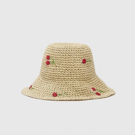 Natural beige straw hat with a wide brim and red cherry embroidery accent.
