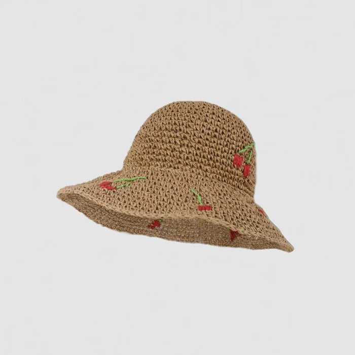 Front view of khaki straw hat version featuring the sweet cherry embroidery.