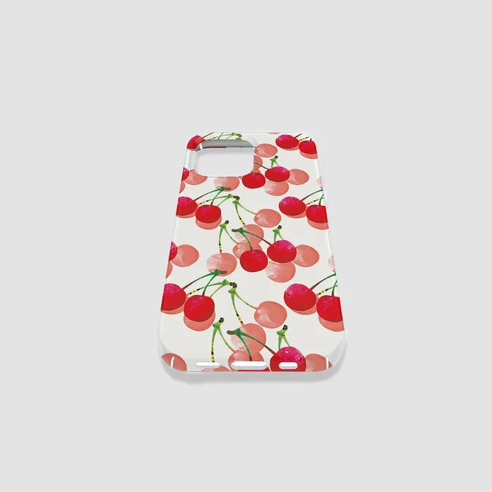 Vibrant cherry graphic on white silicone case with light pink circular accents. Playful feminine style.