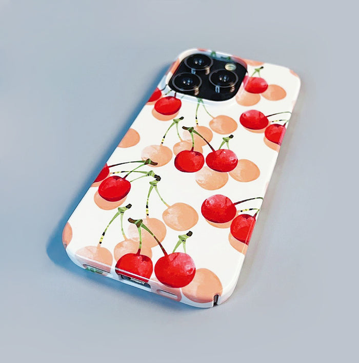 Front view of Cherry Case. Playful fruit graphic printed on a soft-touch matte silicone base.
