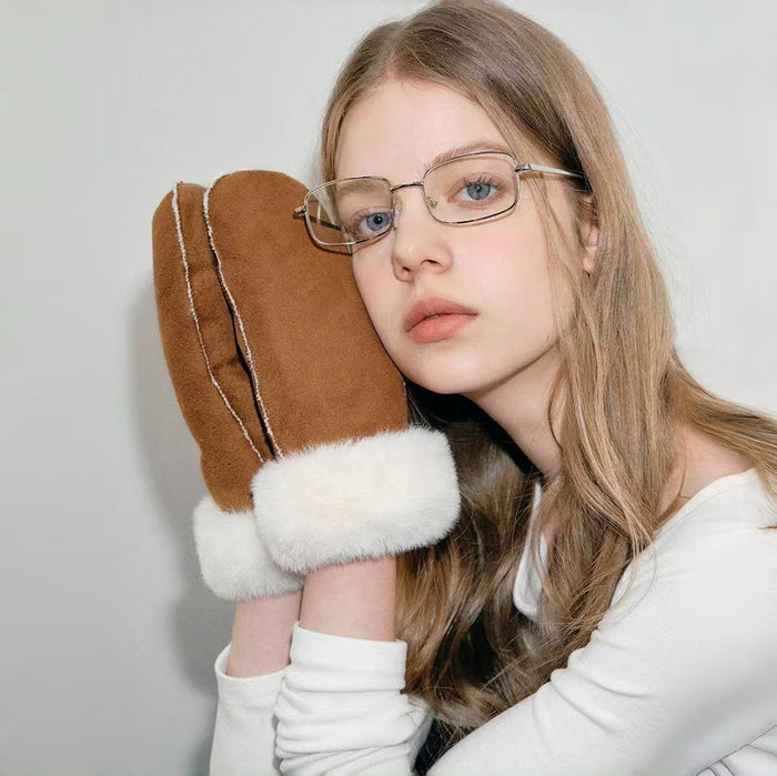 Chestnut suede gloves shown on model hands; smooth suede texture for winter street wear and commuting.