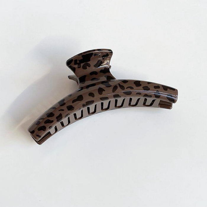 Front view of dark Chocolate Leopard Print Hair Claw in arc shape , easy for workdays.