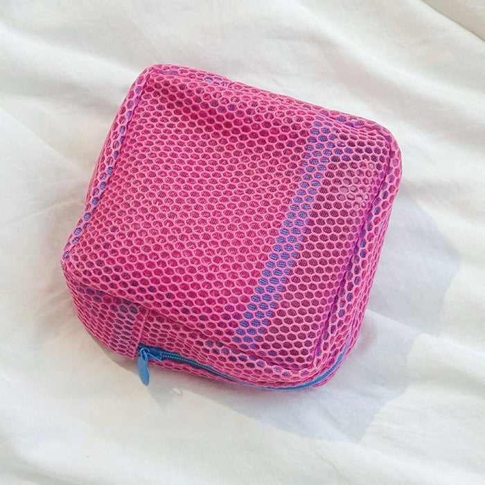 Pink Chroma mesh pouch with blue zipper; see-through zip cube for makeup, chargers, or beach bag storage.