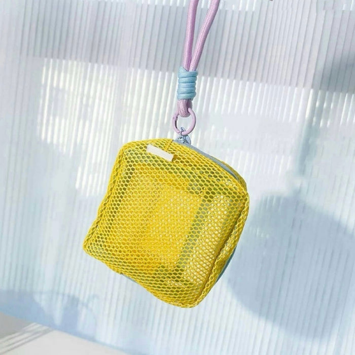 Yellow Chroma mesh pouch with lanyard strap, hanging shot; lightweight zip organizer for keys or mini toiletries.