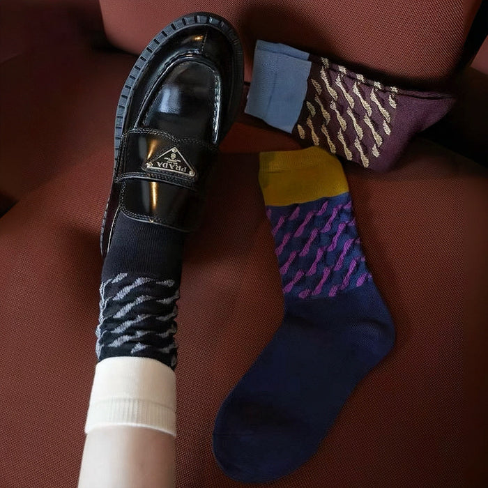 Three pairs of Classical Wave Rhythm Socks: one black, one navy blue and one brown.