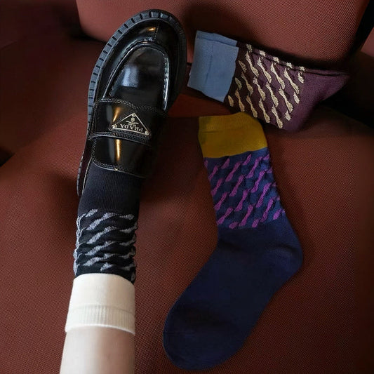 Three pairs of Classical Wave Rhythm Socks: one black, one navy blue and one brown.