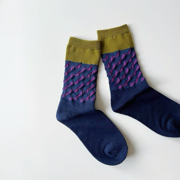 Angled view of  Classical Wave Rhythm Socks in navy blue.