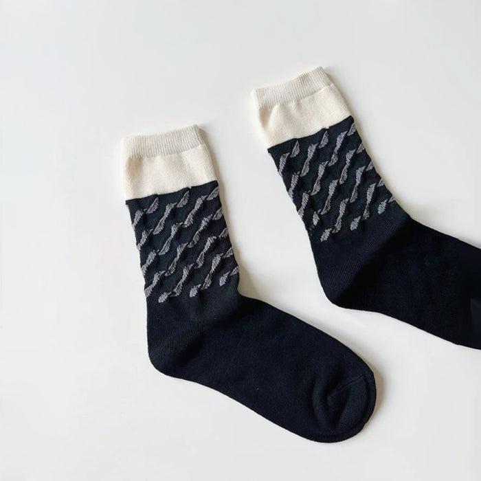 Flat lay of Classical Wave Rhythm Socks in black, great for daily wear and lounging.