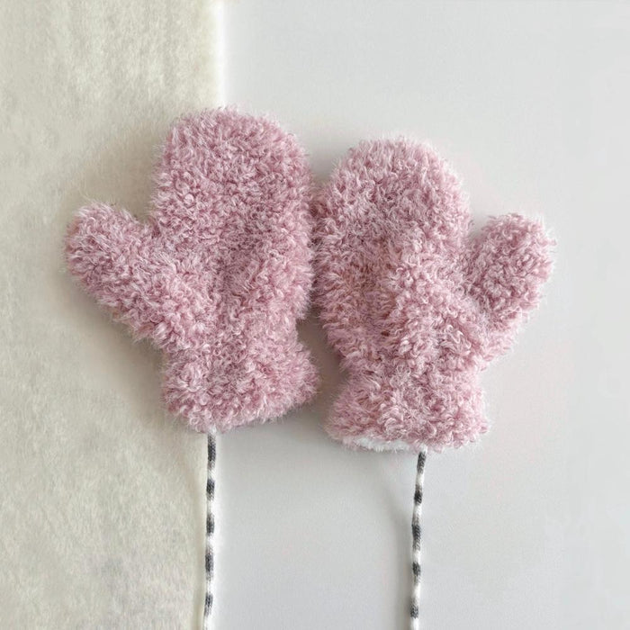 Pink cloud-touch fluffy gloves with plush texture and ribbed cuff; cute warmth for winter outings.