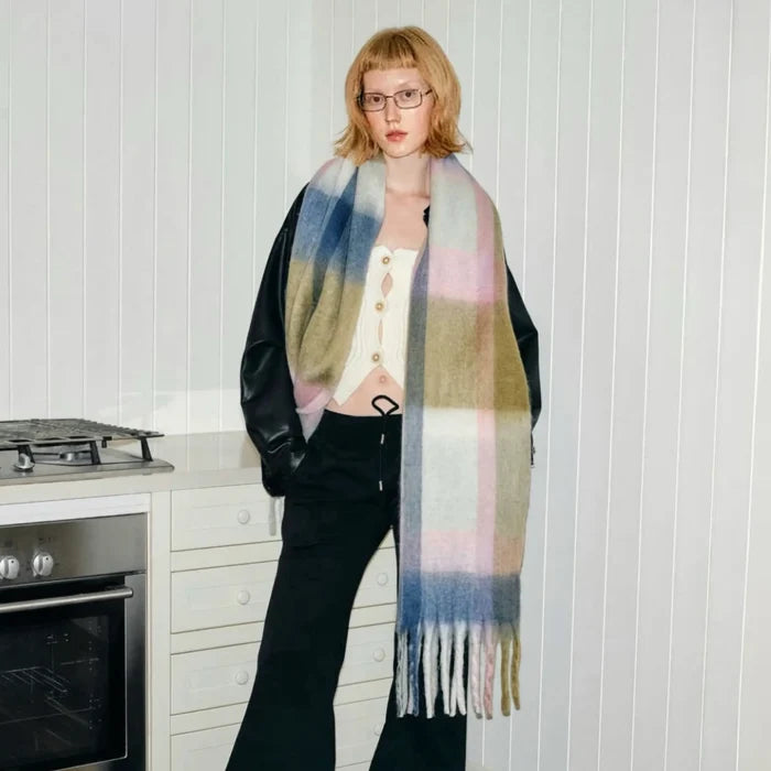 Model wearing a wool scarf in beige, easy for weekend styling and gifting.
